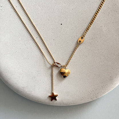 Necklace with a heart and star pendants