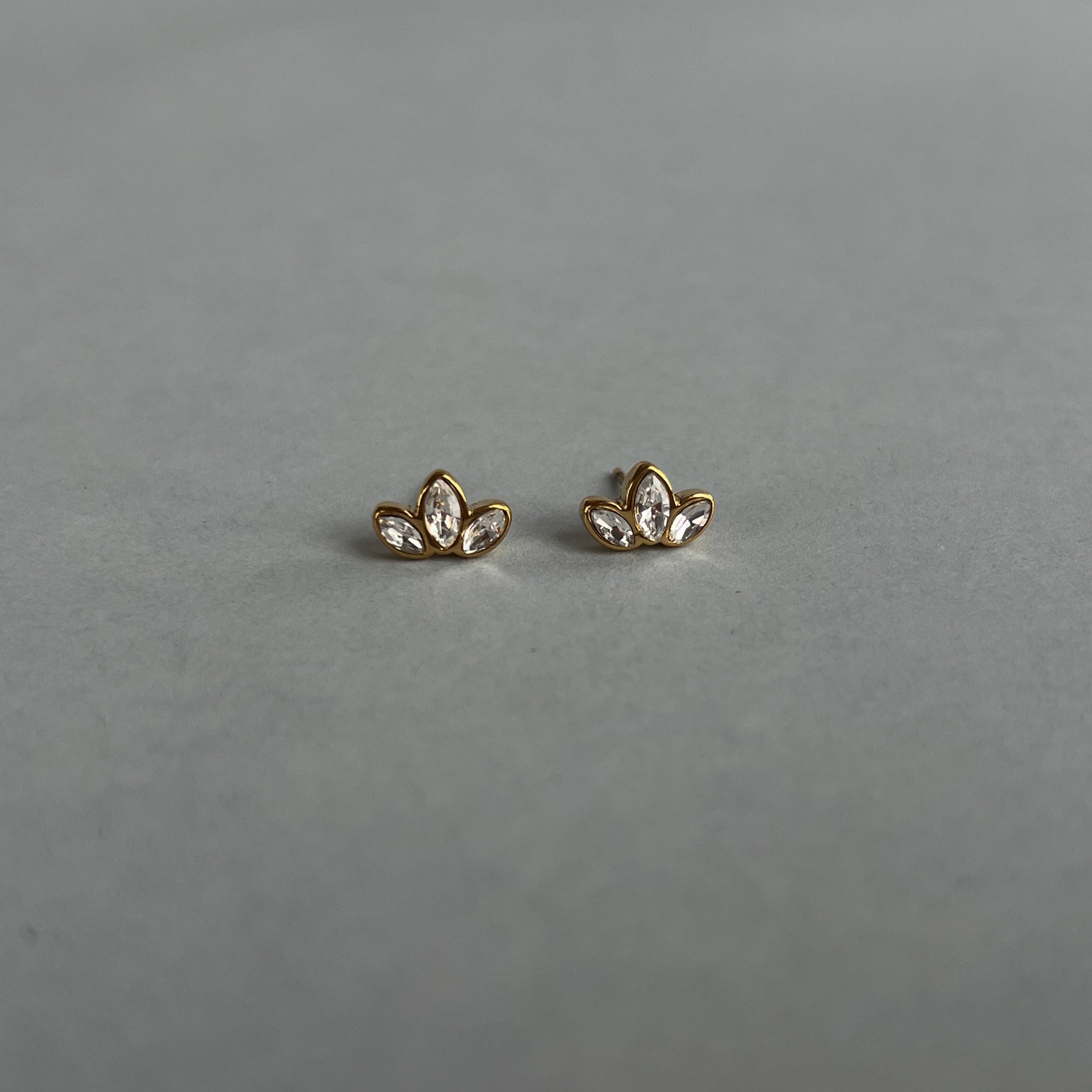 Gold colour small studs with zircons