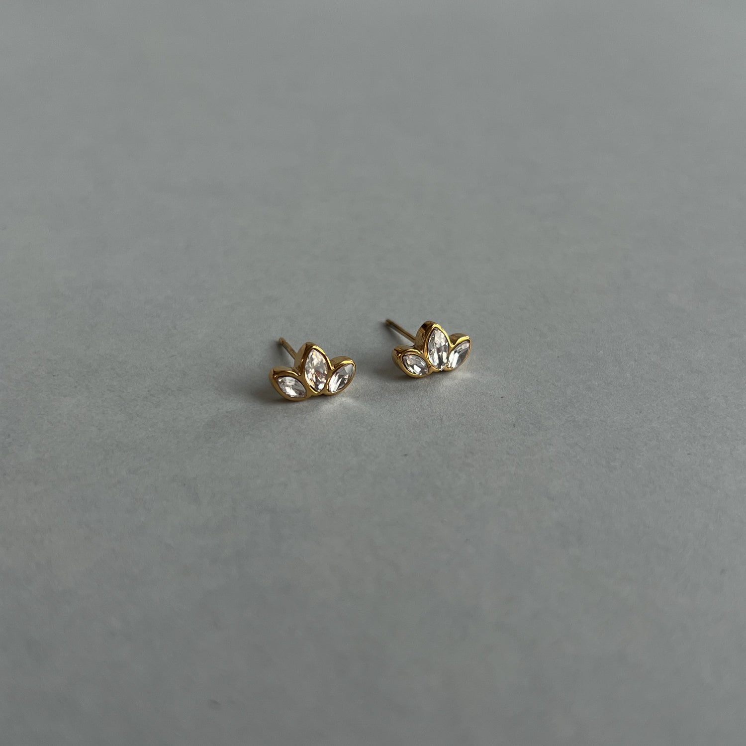 Gold colour small studs with zircons