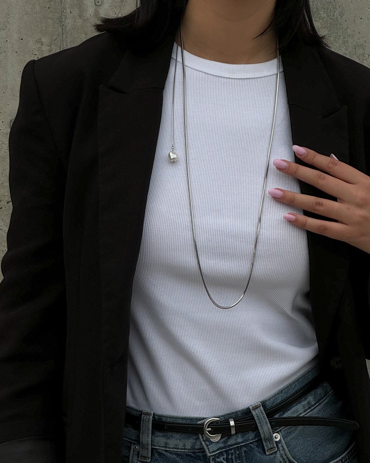 Modern silver colour necklace with a pearl